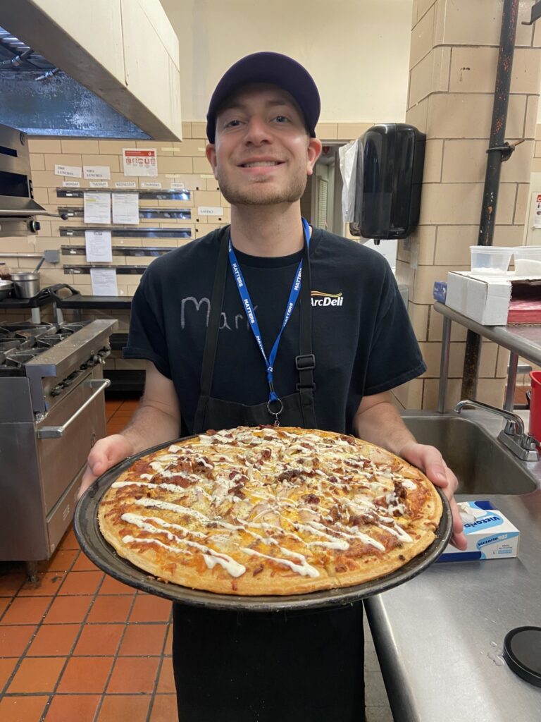 Mark with the pizza he made.